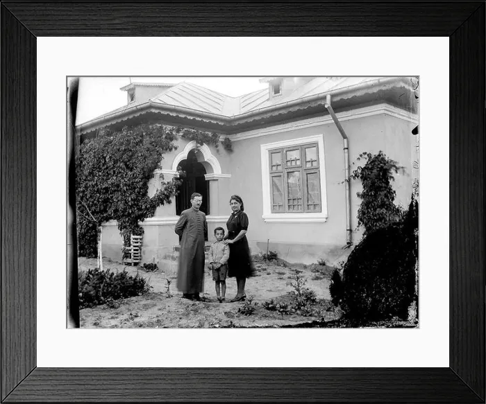 Framed Print : Father Marin Alexandrescu with his wife Ana and eldest son in front of their house in Slobozia
