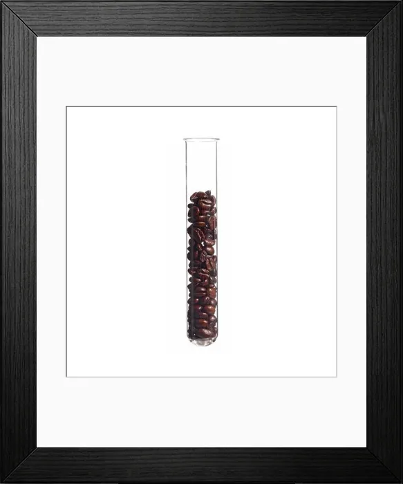 Framed Print : Coffee beans in a test tube, studio shot Framed Print : Coffee beans in a test tube, studio shot
