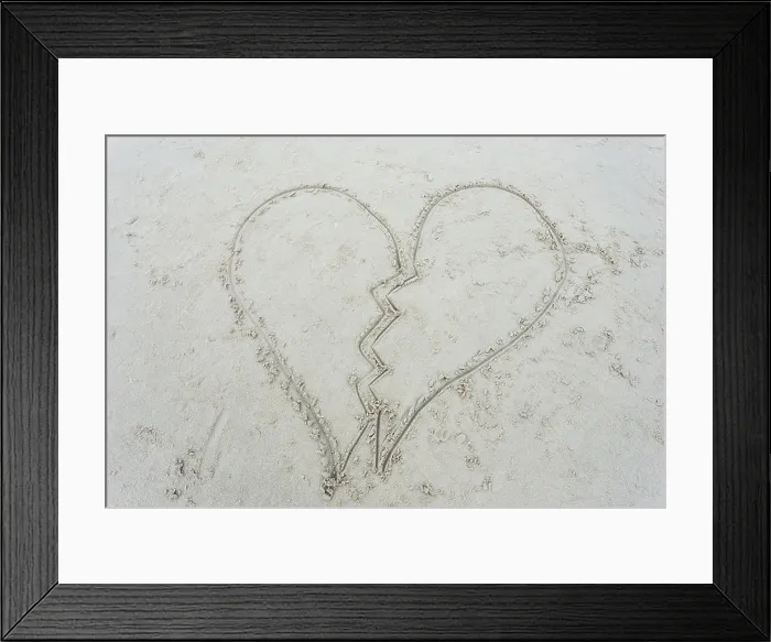 Framed Print : broken heart drawn on sand at beach