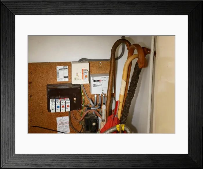Framed Print : An old style electricity meter with fuses in a cupboard Framed Print : An old style electricity meter with fuses in a cupboard