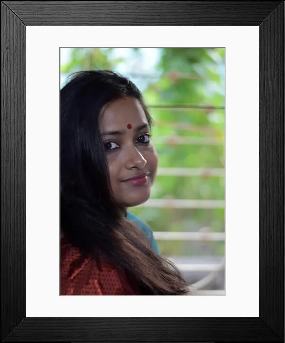 Framed Print : A beautiful bengali lady, standing infront of a window is turning her head to look at someone Framed Print : A beautiful bengali lady, standing infront of a window is turning her head to look at someone