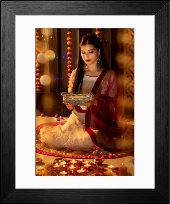 Framed Print : Portrait of an Indian woman holding flowers on a festive occasion. Celebrations at home. Diwali or Christmas Framed Print : Portrait of an Indian woman holding flowers on a festive occasion. Celebrations at home. Diwali or Christmas