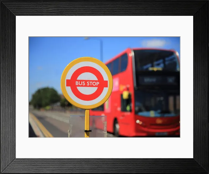 Framed Print : Bus approaching temporary bus stop, in east London, England, UK Framed Print : Bus approaching temporary bus stop, in east London, England, UK