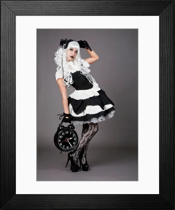 Framed Print : Gothic dressed teenager holding an alarm clock Framed Print : Gothic dressed teenager holding an alarm clock