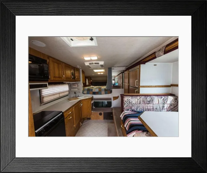 Framed Print : Interior of an Artic Fox truck camper showing the kitchen, dinette and bed Framed Print : Interior of an Artic Fox truck camper showing the kitchen, dinette and bed