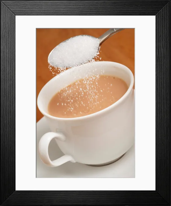 Framed Print : Adding white granulated sugar to cup of tea Framed Print : Adding white granulated sugar to cup of tea