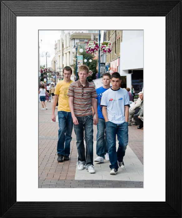 Framed Print : 2 teenage boys walking down the street with 2 more following them Framed Print : 2 teenage boys walking down the street with 2 more following them