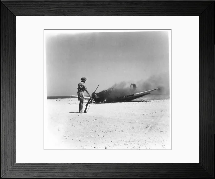 Framed Print : A German bomber is destroyed after being struck by anti-aircraft gunfire at Tobruk