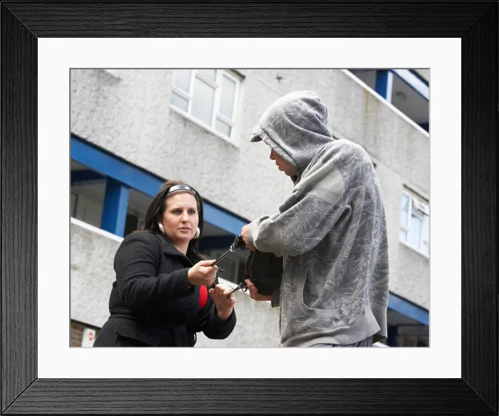 Framed Print : Man Mugging Woman In Street Framed Print : Man Mugging Woman In Street