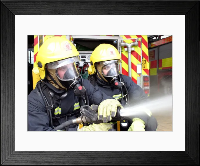 Framed Print : Two firefighters with a hose Framed Print : Two firefighters with a hose