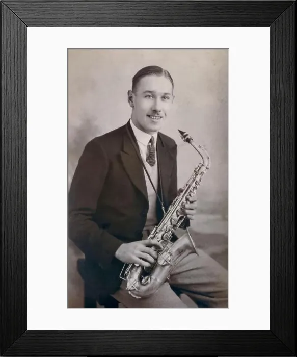 Framed Print : A portrait of a young man with his Alto Saxophone by the Los Angeles Portrait Studios Framed Print : A portrait of a young man with his Alto Saxophone by the Los Angeles Portrait Studios