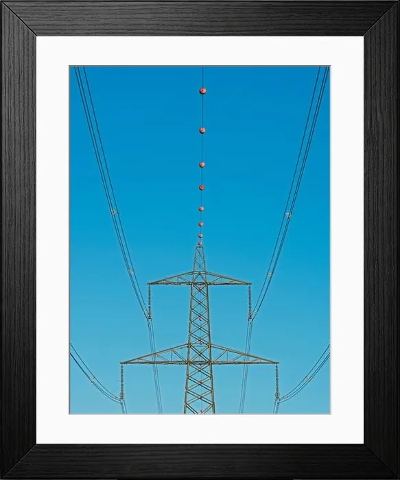 Framed Print : Aerial marker balls on overhead electricity lines, Welney, Norfolk, England Framed Print : Aerial marker balls on overhead electricity lines, Welney, Norfolk, England