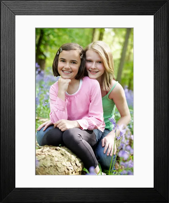 Framed Print : Two girls sitting together in a wood full of bluebells Framed Print : Two girls sitting together in a wood full of bluebells