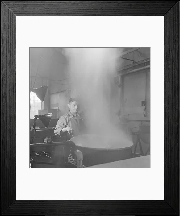 Framed Print : Man monitors the blanching of asparagus rods in a boiler Framed Print : Man monitors the blanching of asparagus rods in a boiler