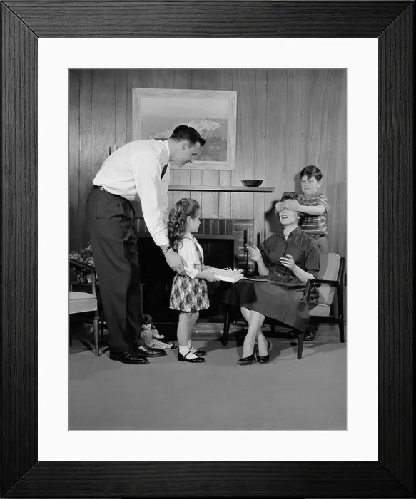 Framed Print : 1950s FAMILY LIVING ROOM WOMAN MOTHER GETTING SURPRISE GIFT FROM CHILDREN DAUGHTER SON HUSBAND Framed Print : 1950s FAMILY LIVING ROOM WOMAN MOTHER GETTING SURPRISE GIFT FROM CHILDREN DAUGHTER SON HUSBAND