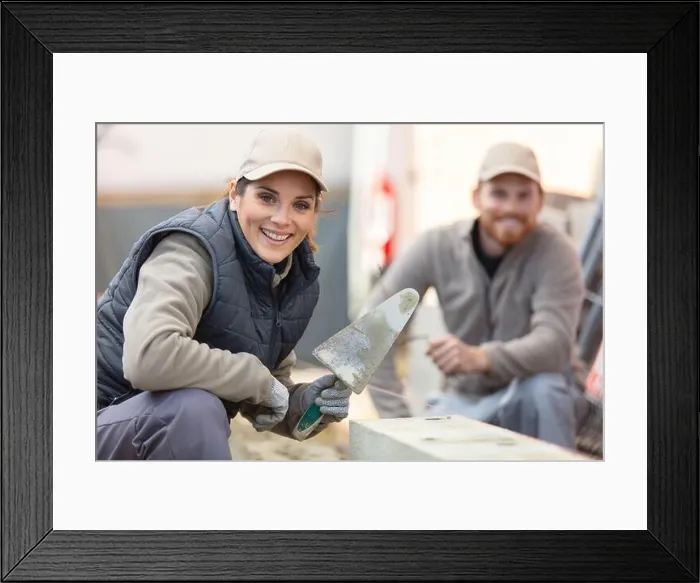 Framed Print : male female builders builder on building site Framed Print : male female builders builder on building site