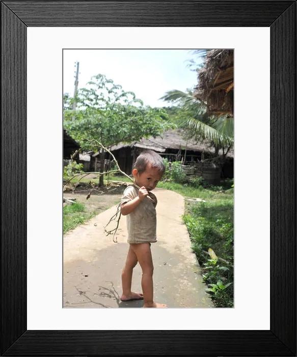 Framed Print : A Lao boy in Luang Prabang in Laos Framed Print : A Lao boy in Luang Prabang in Laos