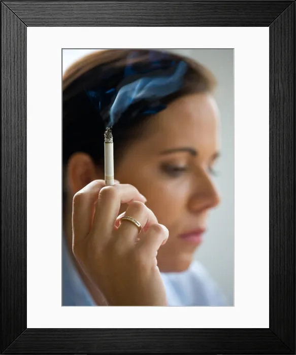 Framed Print : woman smoking a cigarette Framed Print : woman smoking a cigarette