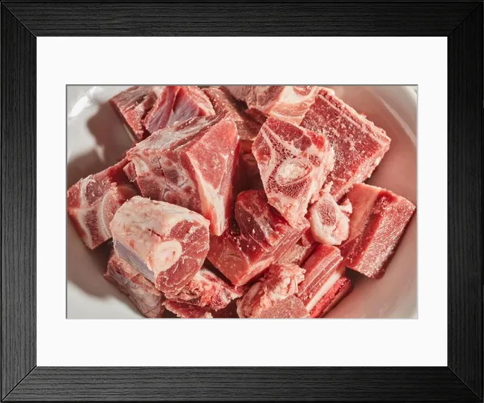 Framed Print : cut up pieces of raw goat meat Framed Print : cut up pieces of raw goat meat