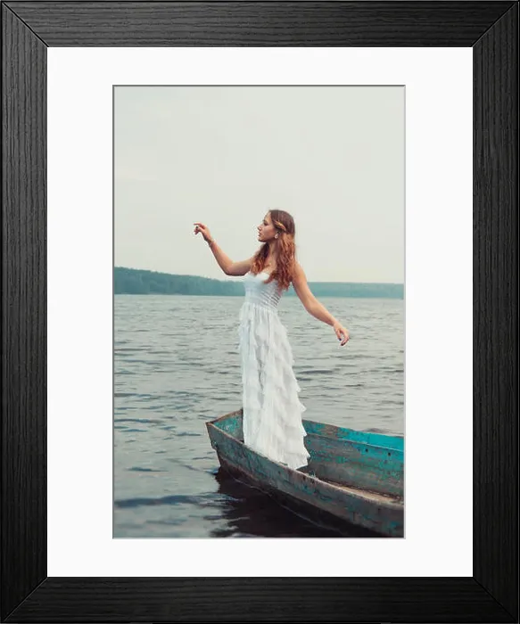 Framed Print : dreamy mysterious blonde girl in a white dress in an old boat on the lake