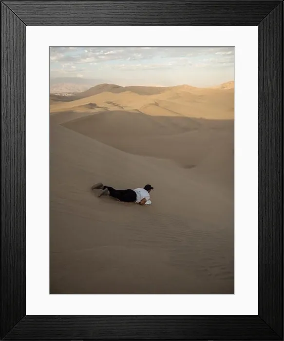 Framed Print : Tourist sliding down slopes of Huacahina sand dunes on snowboard sandboarding adventure adrenaline fun extreme sports Framed Print : Tourist sliding down slopes of Huacahina sand dunes on snowboard sandboarding adventure adrenaline fun extreme sports