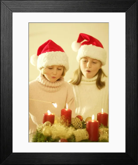 Framed Print : Girls, Santa's hats, Advent wreath Framed Print : Girls, Santa's hats, Advent wreath