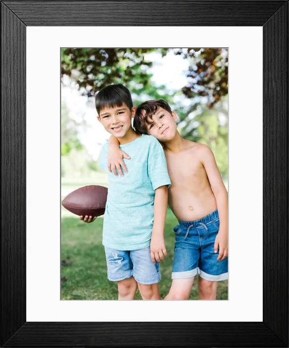 Framed Print : Young boys (6-7, 8-9) with american football ball Framed Print : Young boys (6-7, 8-9) with american football ball