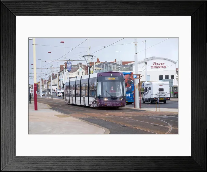 Framed Print : Blackpool Flexity tram passing a bus on the promenade, Blackpool