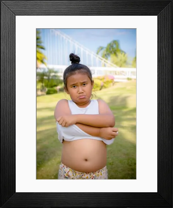 Framed Print : Fat girl kid show big Belly, paunch, girl like eat Framed Print : Fat girl kid show big Belly, paunch, girl like eat