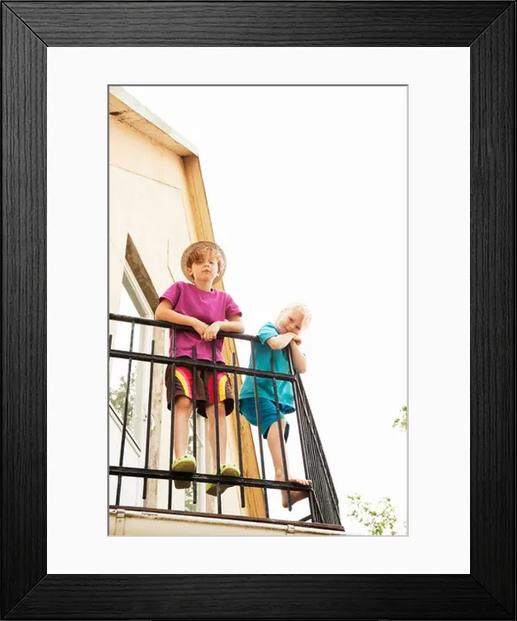 Framed Print : Children looking down from balcony Framed Print : Children looking down from balcony