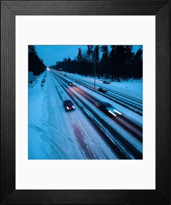Framed Print : Man takes a piss in February twilight on Kiev circle road without trying to step in snow as cars on winter tires are