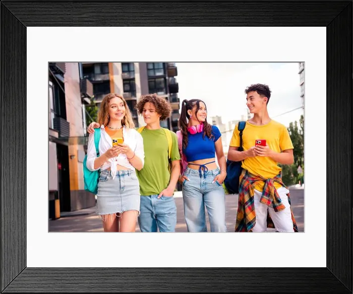 Framed Print : Four diverse friends enjoying their time together outdoors in a vibrant urban setting showing genuine smiles and bonding Framed Print : Four diverse friends enjoying their time together outdoors in a vibrant urban setting showing genuine smiles and bonding
