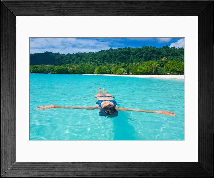 Framed Print : Woman floating in the water off Champagne Beach, Espiritu Santo, Sanma Province, Vanuatu Framed Print : Woman floating in the water off Champagne Beach, Espiritu Santo, Sanma Province, Vanuatu