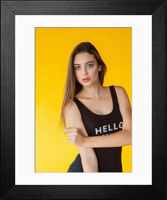Framed Print : Girl on the background of a studio photo Framed Print : Girl on the background of a studio photo