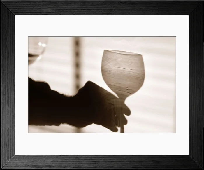 Framed Print : Shadow of a hand holding a glass of wine Framed Print : Shadow of a hand holding a glass of wine