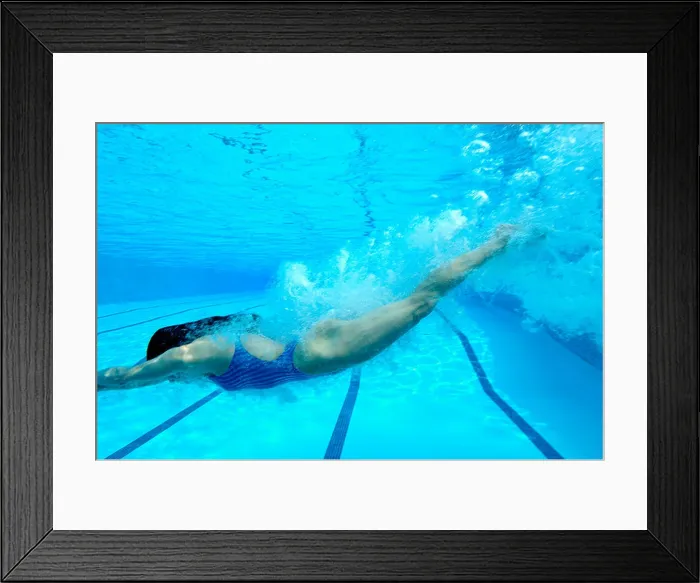Framed Print : Woman diving in swimming pool, underwater view Framed Print : Woman diving in swimming pool, underwater view