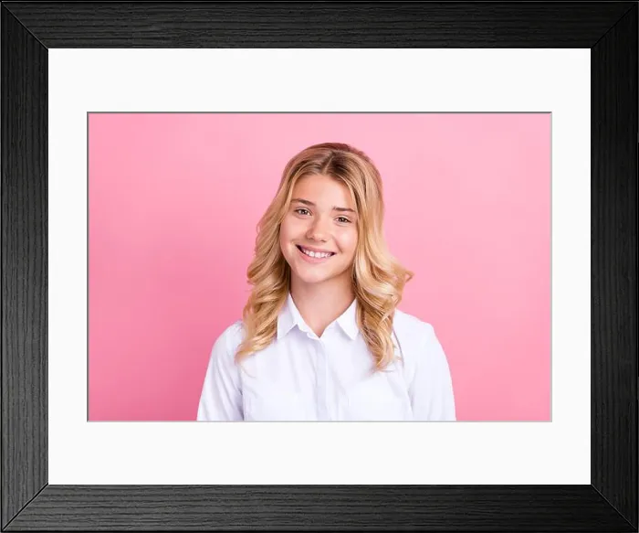 Framed Print : Portrait of attractive cheerful wavy-haired preteen girl wearing white shirt isolated over pink pastel color background Framed Print : Portrait of attractive cheerful wavy-haired preteen girl wearing white shirt isolated over pink pastel color background