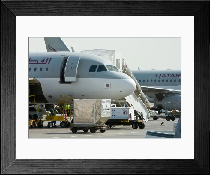 Framed Print : Qatar Airways aircraft being loaded with containers at Doha Airport in Qatar Framed Print : Qatar Airways aircraft being loaded with containers at Doha Airport in Qatar