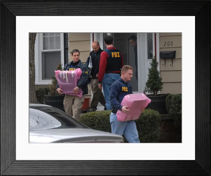 Framed Print : FRI Agents remove computers from a police detectives home after he was arrested for embezzlement Framed Print : FRI Agents remove computers from a police detectives home after he was arrested for embezzlement