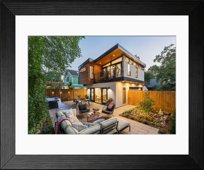 Framed Print : Modern ADU in backyard of house with large outdoor living space at dusk with lights on Framed Print : Modern ADU in backyard of house with large outdoor living space at dusk with lights on