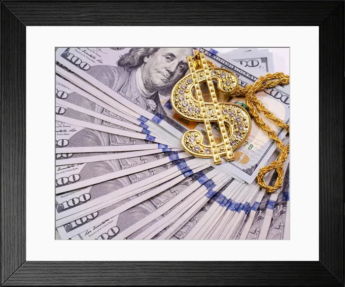 Framed Print : Gold Dollar Sign Necklace on a United States Dollars Banknotes Framed Print : Gold Dollar Sign Necklace on a United States Dollars Banknotes