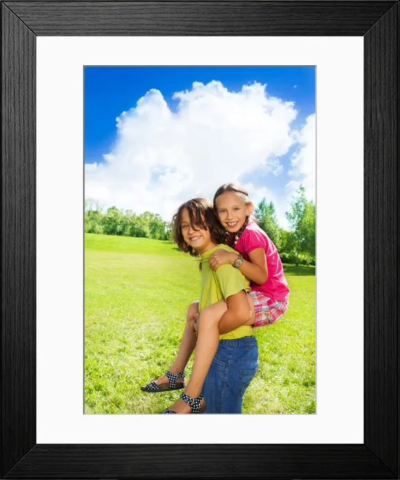 Framed Print : boy carry girl on his back, both look happy and smiling, in the park on sunny summer day Framed Print : boy carry girl on his back, both look happy and smiling, in the park on sunny summer day