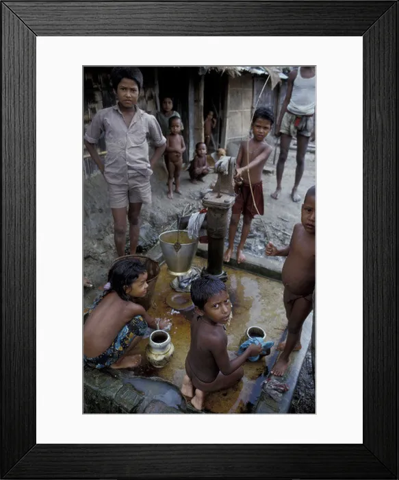 Framed Print : Asia, Bangladesh, Dhaka Children pumping water Framed Print : Asia, Bangladesh, Dhaka Children pumping water