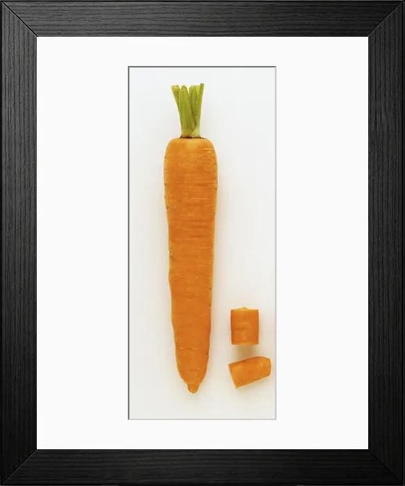Framed Print : A whole Carrot and two pieces next to it Framed Print : A whole Carrot and two pieces next to it