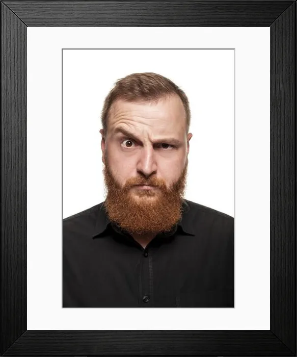 Framed Print : Portrait of a young, chubby, redheaded man with a beard in a black shirt Framed Print : Portrait of a young, chubby, redheaded man with a beard in a black shirt
