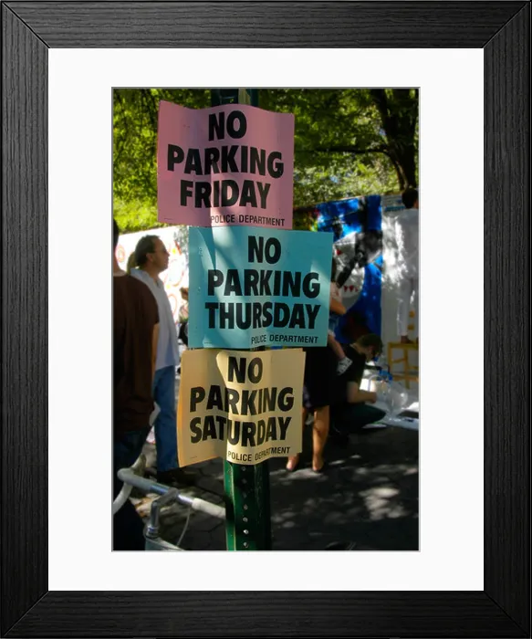 Framed Print : NYPD No Parking signs in the East Village during a street fair Framed Print : NYPD No Parking signs in the East Village during a street fair