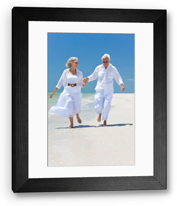 Framed Print : Happy senior man and woman couple running Framed Print : Happy senior man and woman couple running