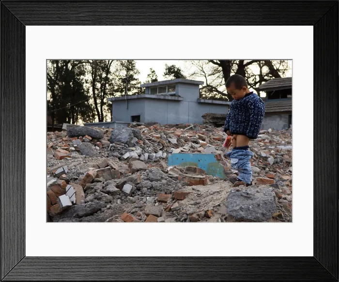 Framed Print : a boy peeing in a neighbourhood Hutong partially destroyed and marked for demolition Beijing China Framed Print : a boy peeing in a neighbourhood Hutong partially destroyed and marked for demolition Beijing China
