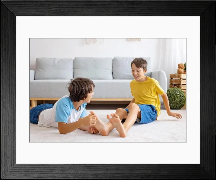 Framed Print : Happy positive children, tickling on the feet Framed Print : Happy positive children, tickling on the feet