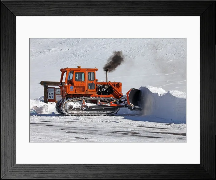 Framed Print : Caterpillar bulldozer push snow off mountain road central Utah. Tracked orange colored vehicle with diesel engine Framed Print : Caterpillar bulldozer push snow off mountain road central Utah. Tracked orange colored vehicle with diesel engine